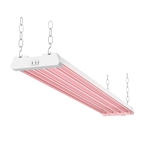 A 4 ft linkable LED grow light strip suspended over a rack of indoor plants