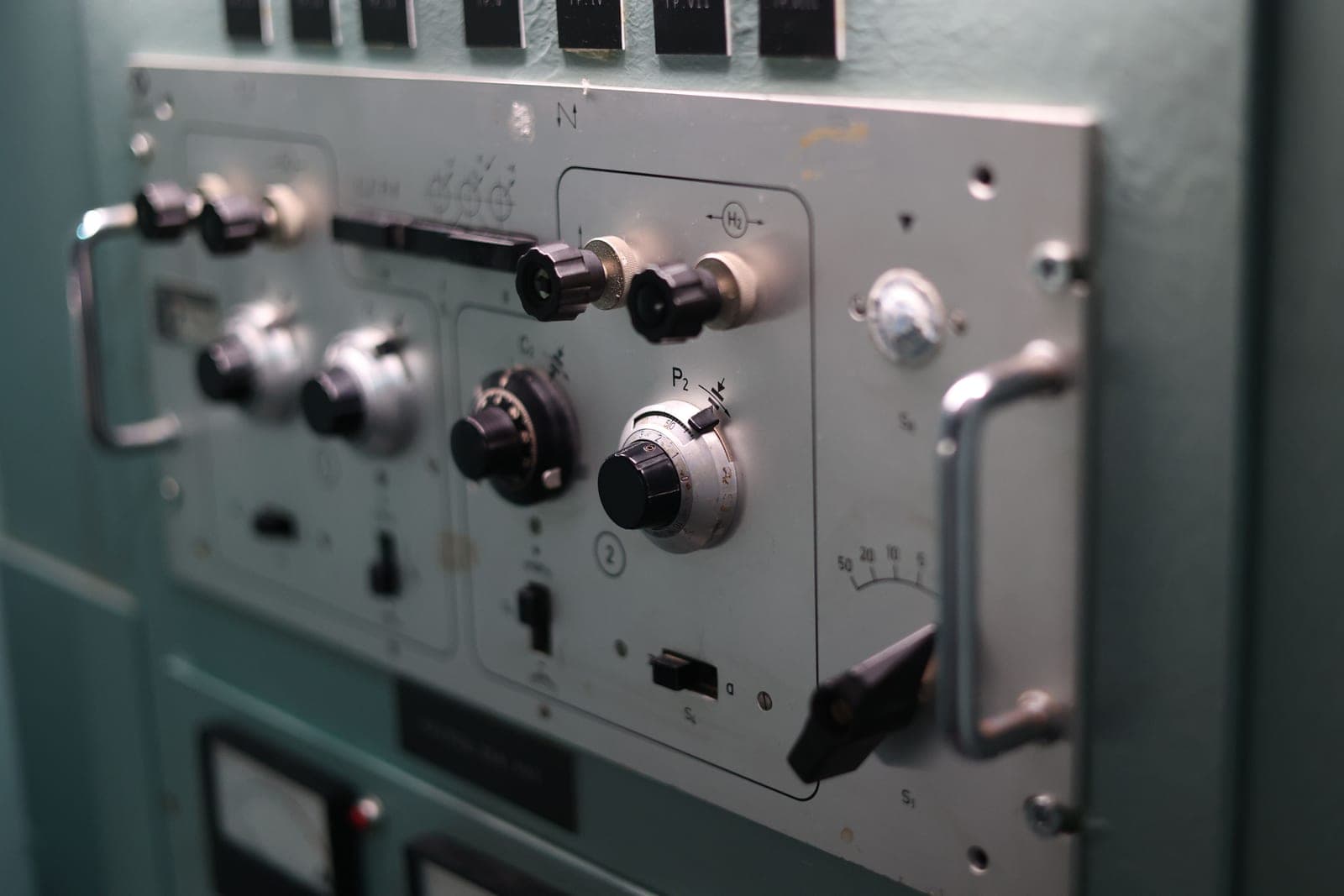Close-up of control dials and switches on an industrial panel