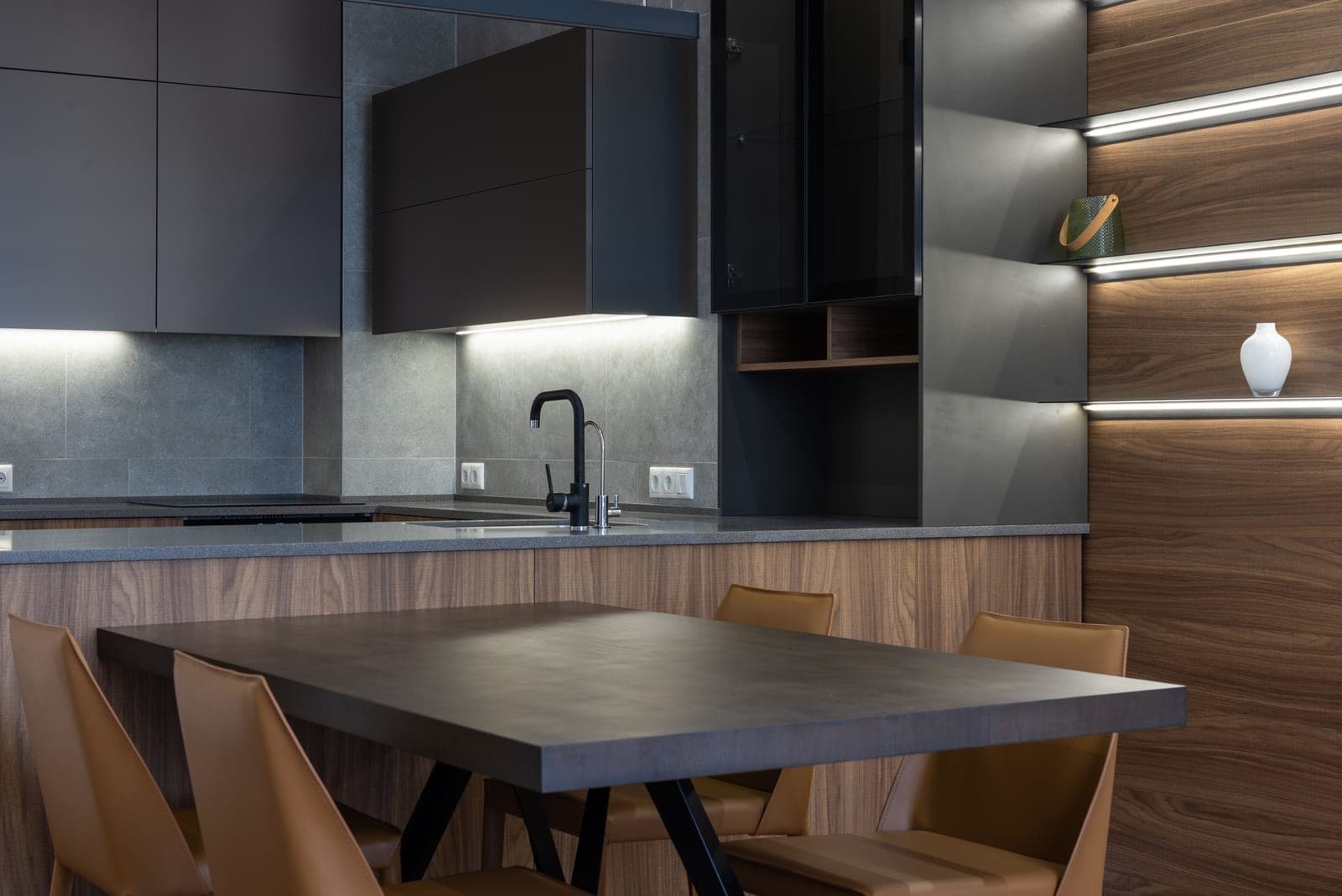 A modern kitchen with cabinets above a clear counter surface