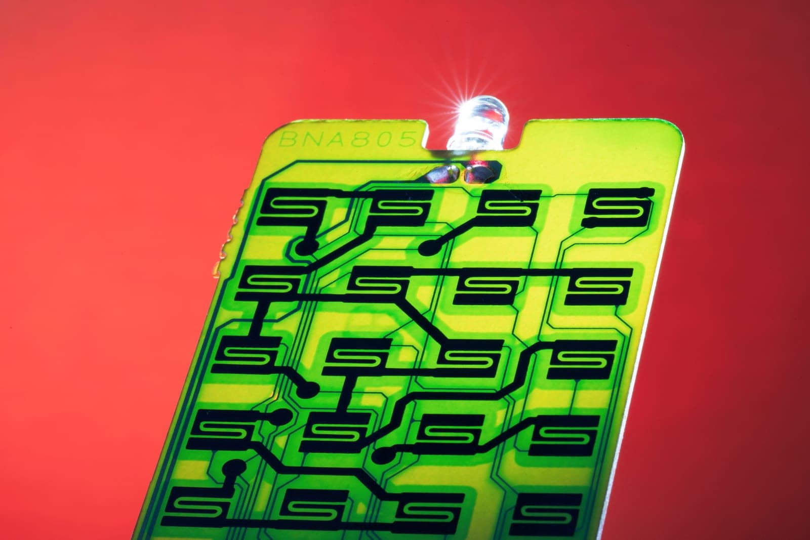 Close-up of a green circuit board with fine electronic detail