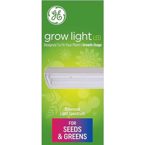 Linked LED strip lights mounted under a wire shelf above trays of seedlings