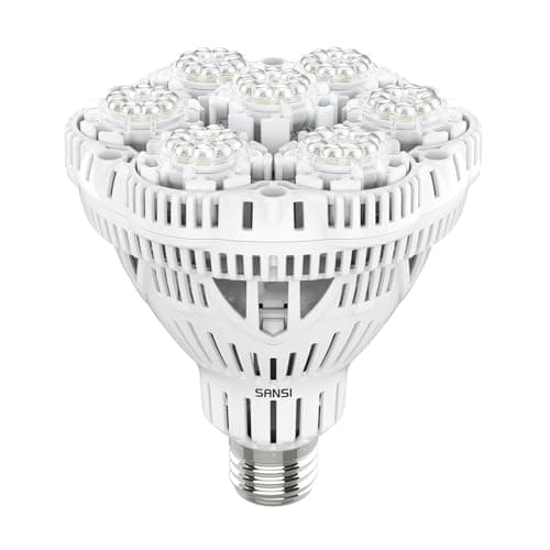 A screw-in LED grow bulb in a desk lamp aimed at a potted houseplant